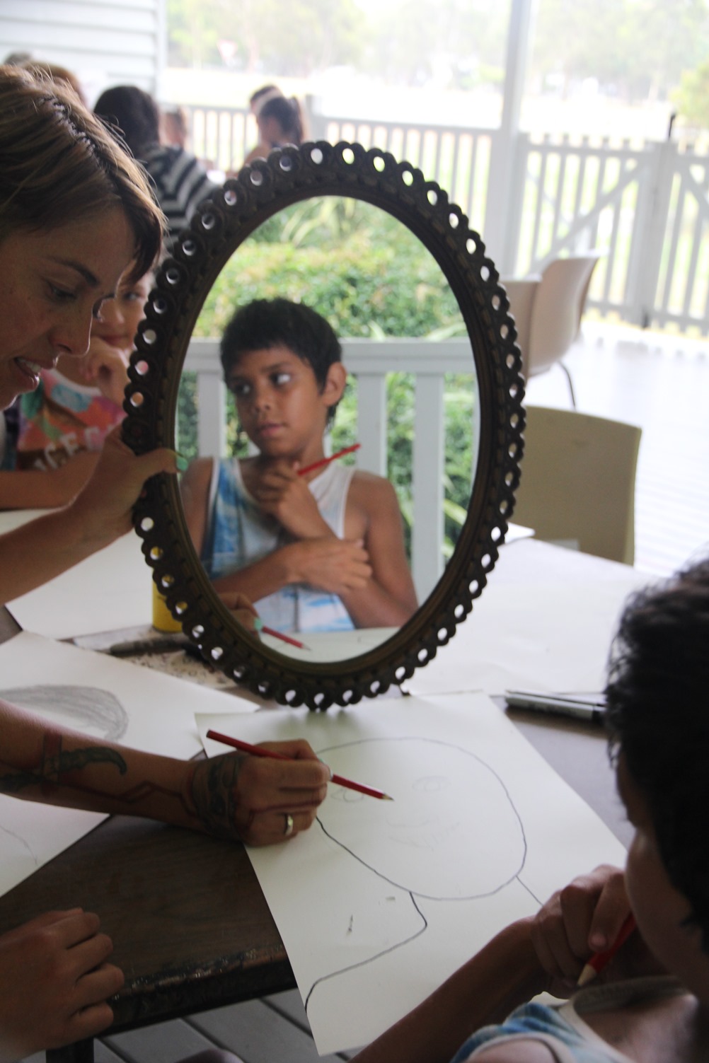 Self portrait: Artist Libby Harward working with Izaac to create his self portrait
